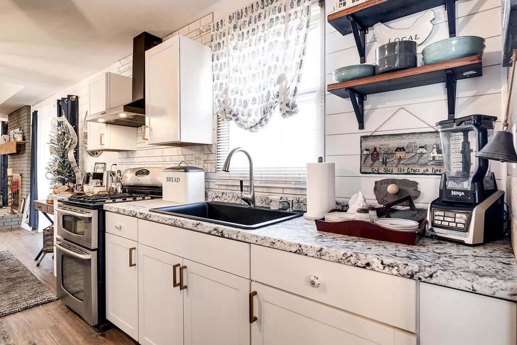 4468 Mt Zion Road Springfield, TN 37172 - Photo 20 of 48 a kitchen with stainless steel appliances granite countertop a sink stove and cabinets