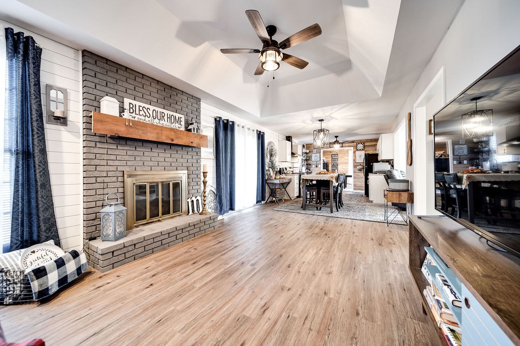 4468 Mt Zion Road Springfield, TN 37172 - Photo 23 of 48 a view of a livingroom with furniture chandelier fan and a fireplace