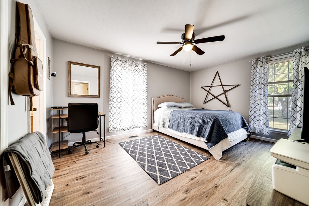 4468 Mt Zion Road Springfield, TN 37172 - Photo 26 of 48 a bedroom with a bed wooden floor and window