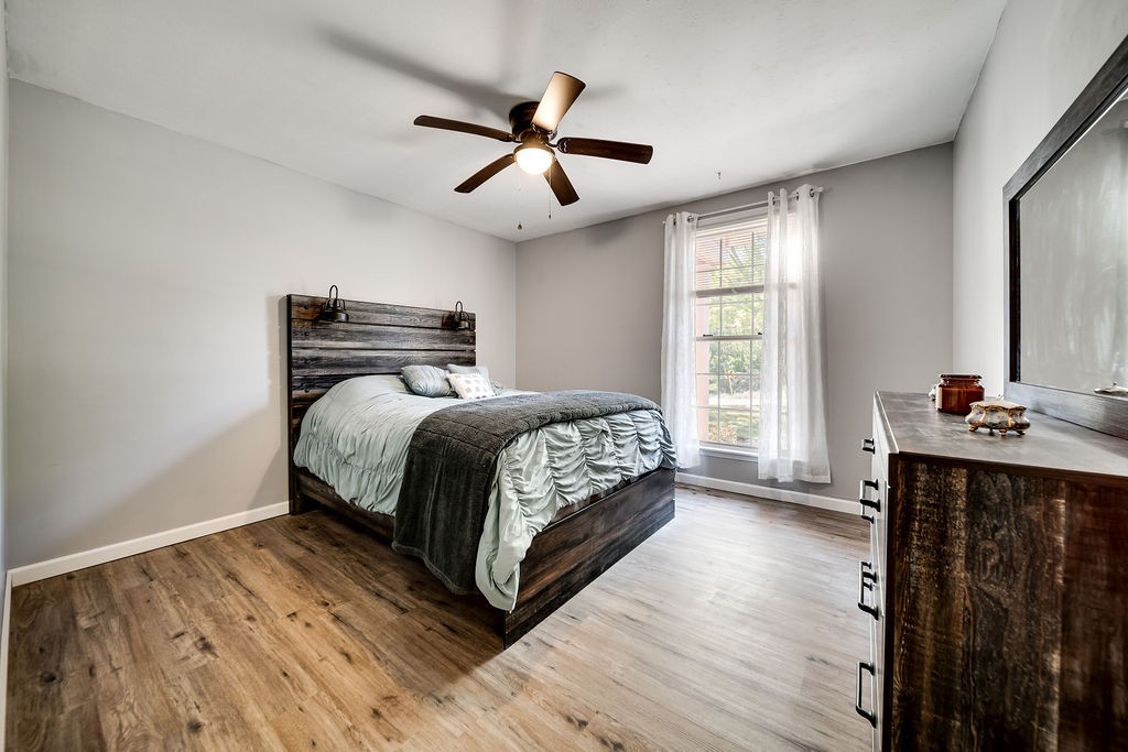 4468 Mt Zion Road Springfield, TN 37172 - Photo 27 of 48 a bedroom with a bed and wooden floor