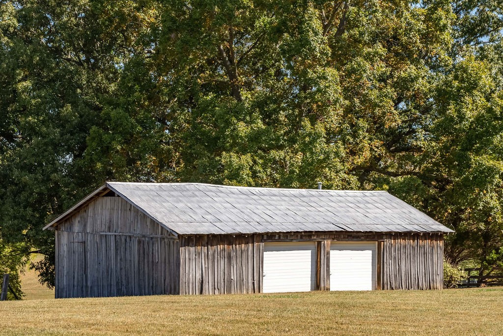 4468 Mt Zion Road Springfield, TN 37172 - Photo 33 of 48 a view of a wooden house with a wooden fence