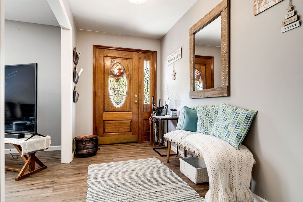 4468 Mt Zion Road Springfield, TN 37172 - Photo 7 of 48 a living room with furniture a rug and a painting on the wall