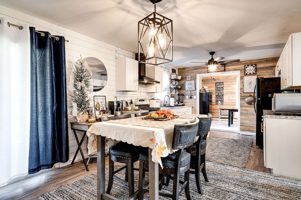 4468 Mt Zion Road Springfield, TN 37172 - Photo 10 of 48 a dining room with stainless steel appliances a table chairs and chandelier
