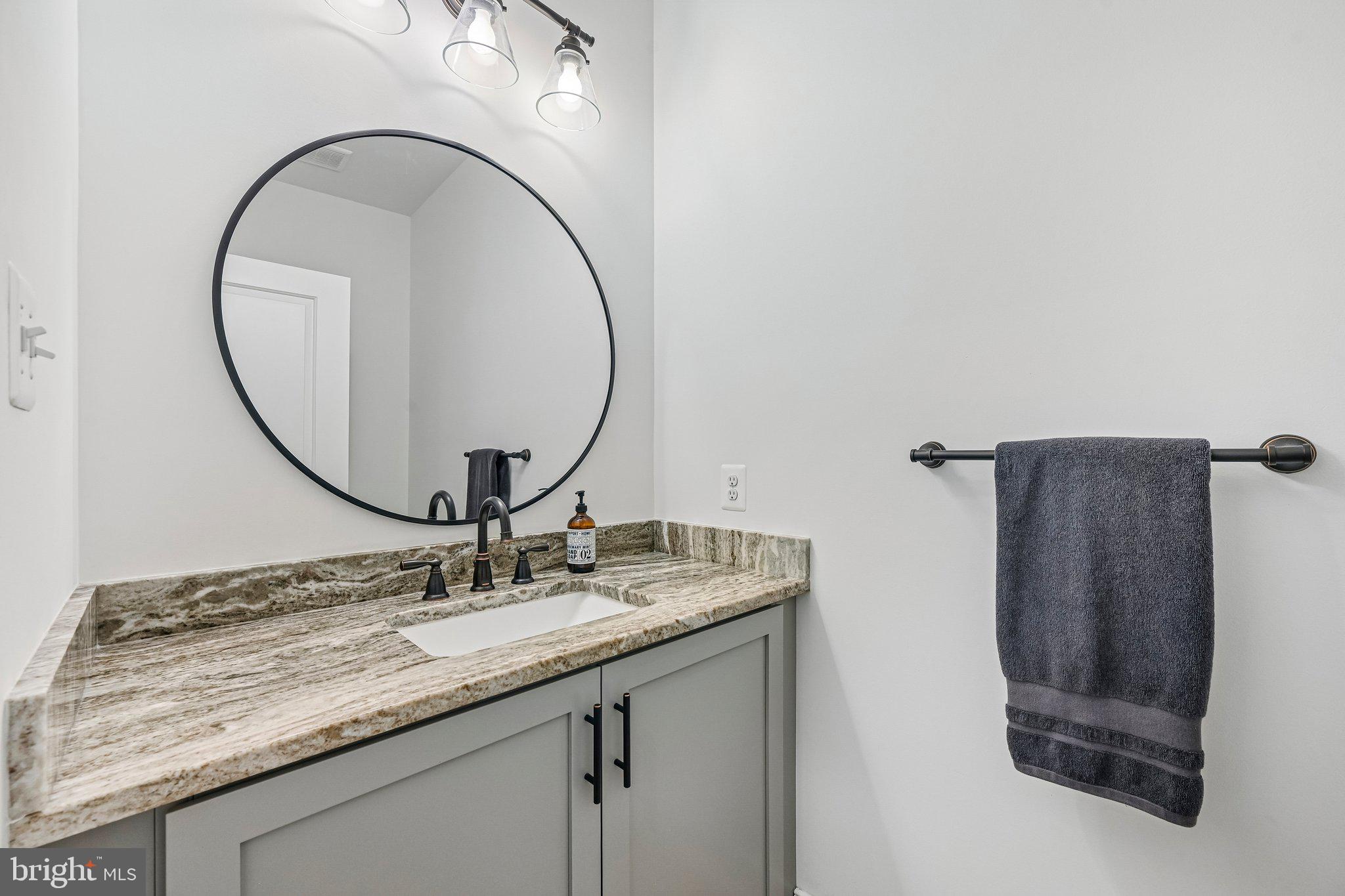 14516 Old Frederick Road Cooksville, MD 21723 - Photo 25 of 100 a bathroom with a sink and a mirror