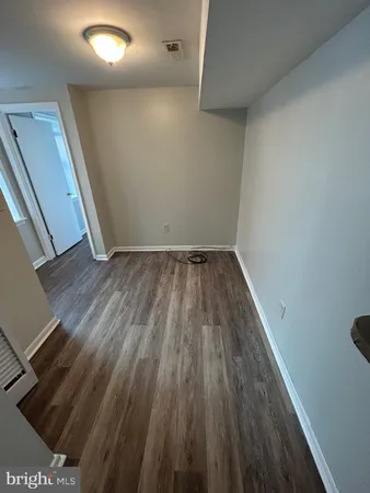 a view of wooden floor in a hallway