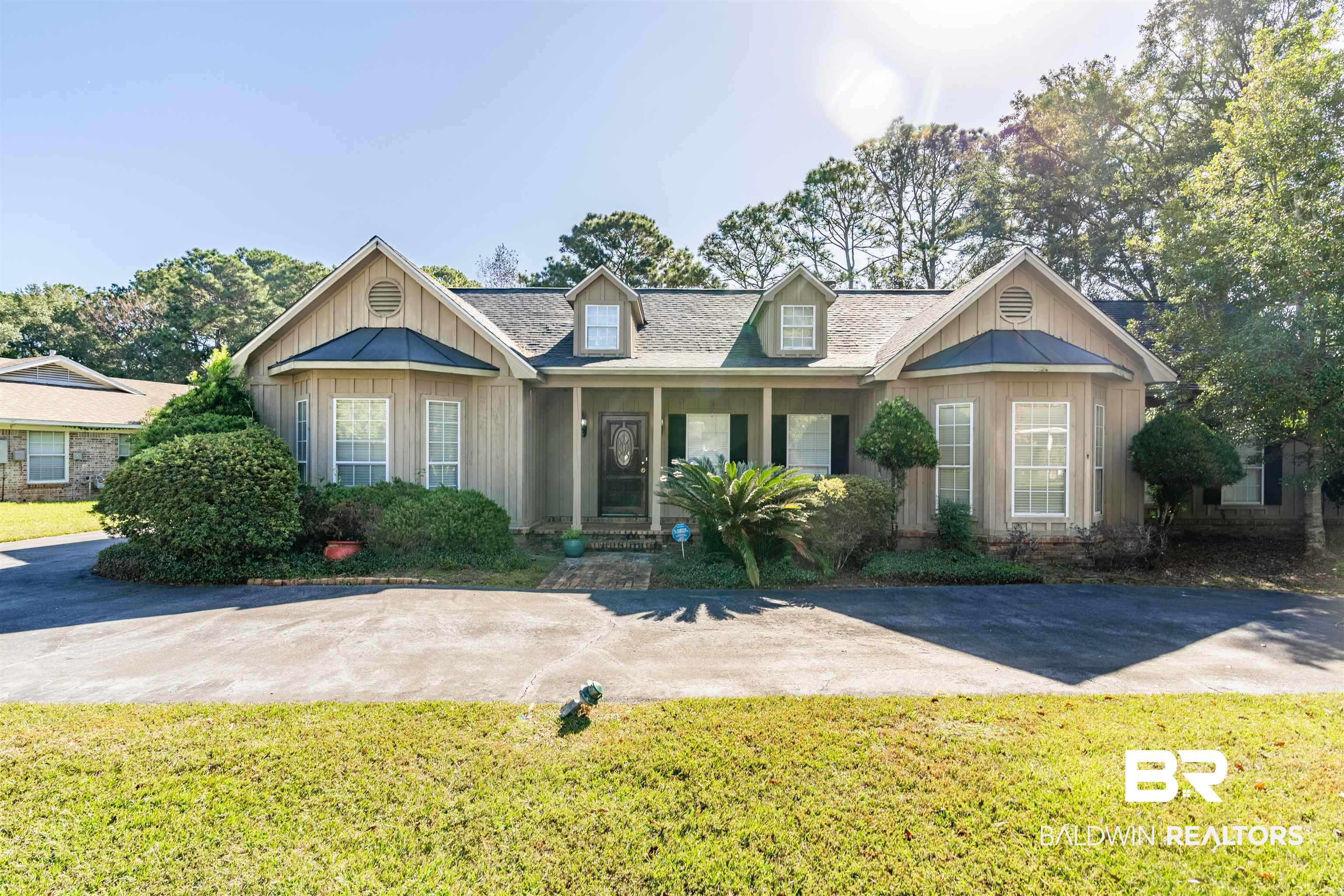 3821 St Andrews Loop East Mobile, AL 36693 - Photo 1 of 41 View of front of house featuring a front yard