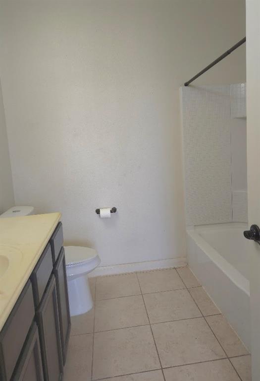 308 Kaylee Way Red Oak, TX 75154 - Photo 15 of 25 Full bath with vanity, light tile patterned floors, and shower / bath combination