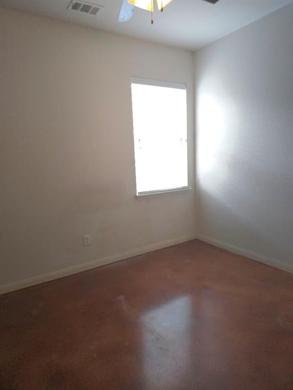 308 Kaylee Way Red Oak, TX 75154 - Photo 18 of 25 Spare room featuring ceiling fan and finished concrete floors