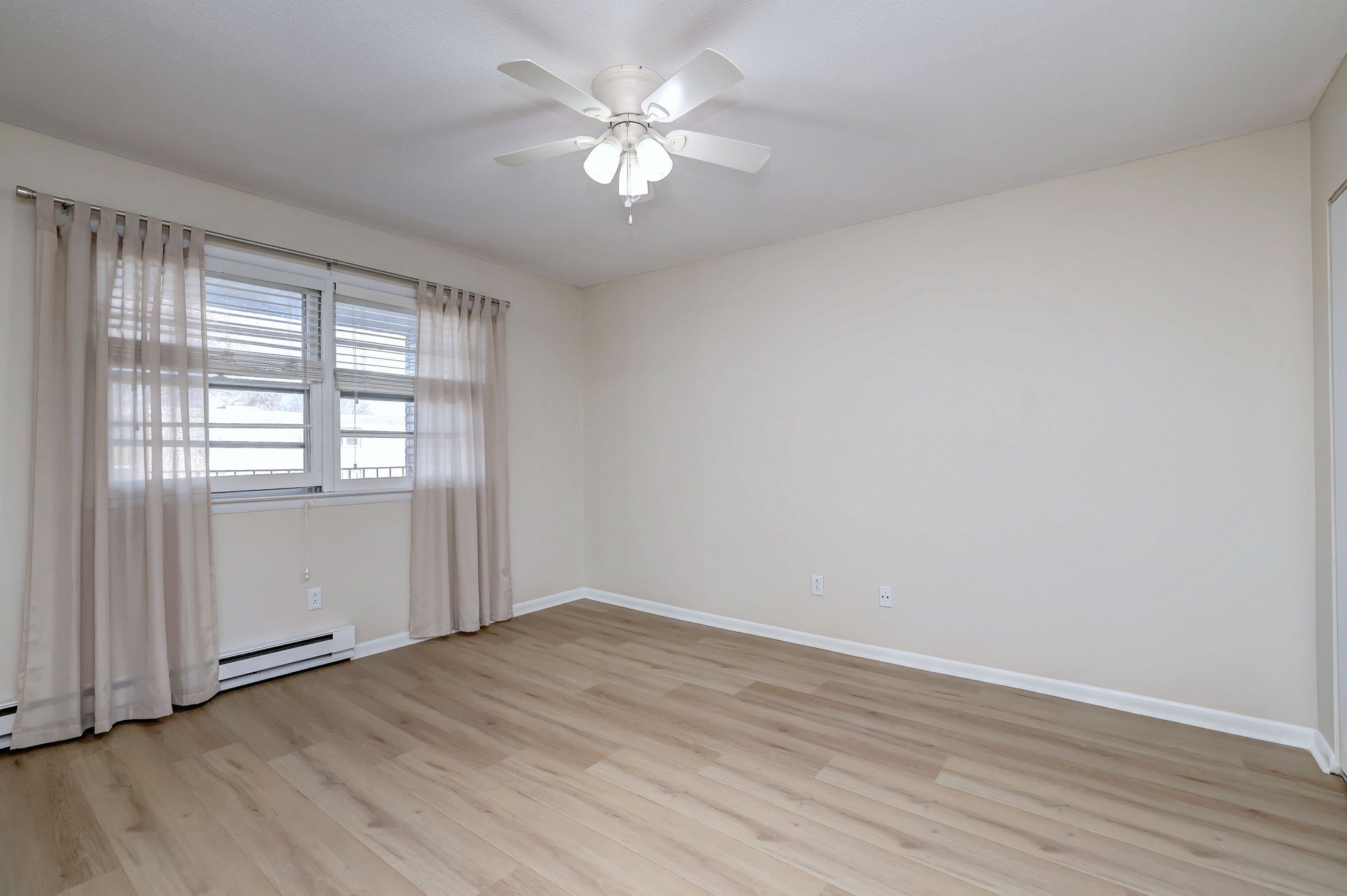 308 Meadowside Road, Unit 202 Milford, CT 06460 - Photo 15 of 40 wooden floor in an empty room with a window