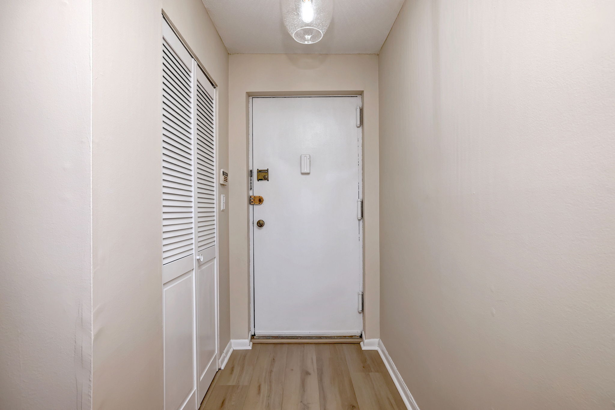 308 Meadowside Road, Unit 202 Milford, CT 06460 - Photo 20 of 40 a view of a hallway with wooden floor