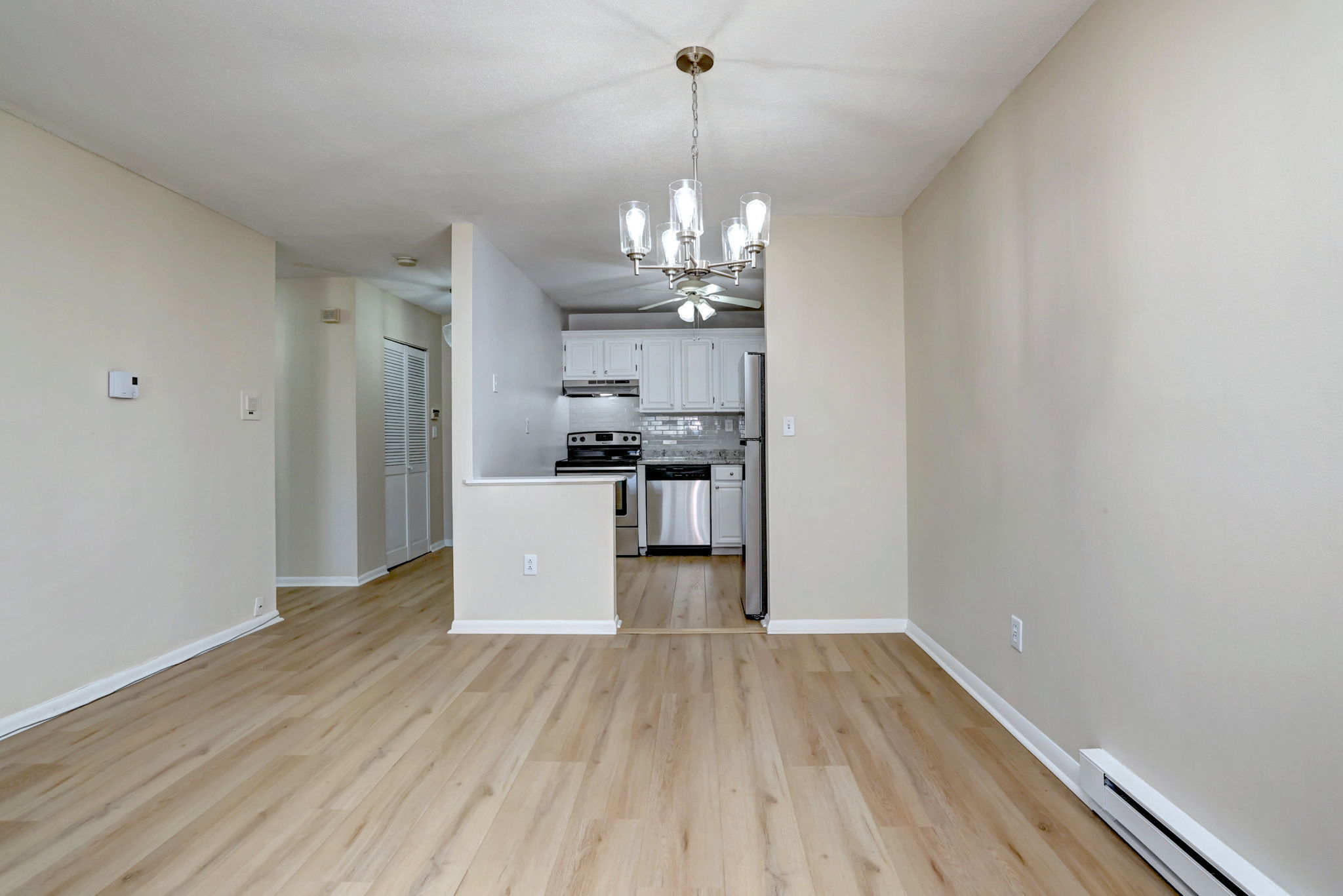 308 Meadowside Road, Unit 202 Milford, CT 06460 - Photo 30 of 40 a view of a kitchen with wooden floor and a window