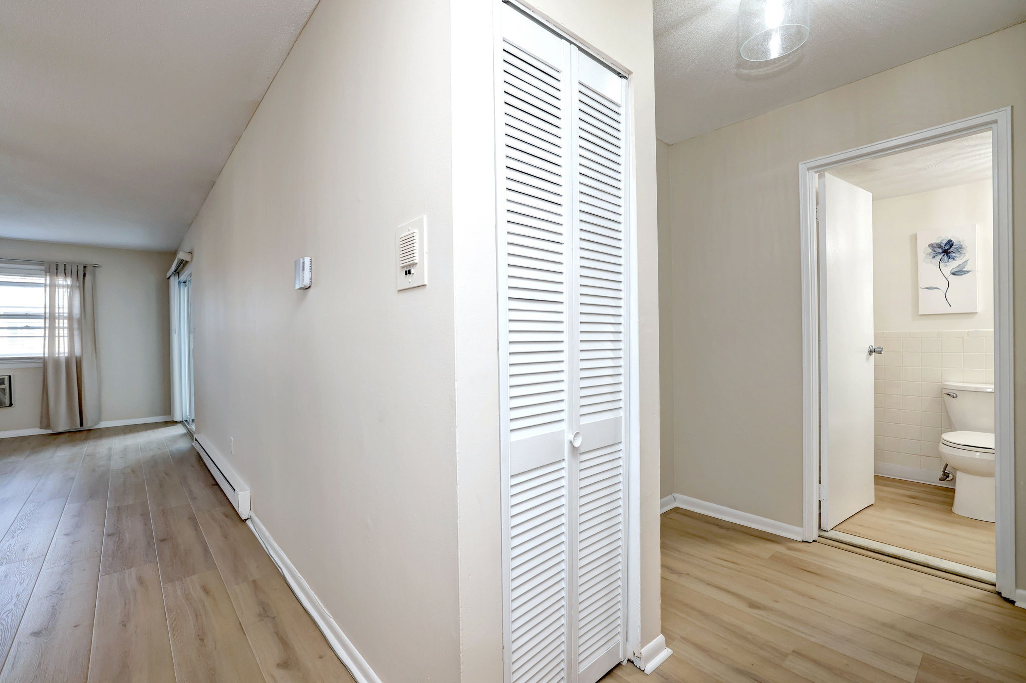 308 Meadowside Road, Unit 202 Milford, CT 06460 - Photo 34 of 40 a view of a room with wooden floor and a bathroom