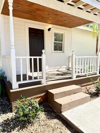 a view of a balcony with chairs