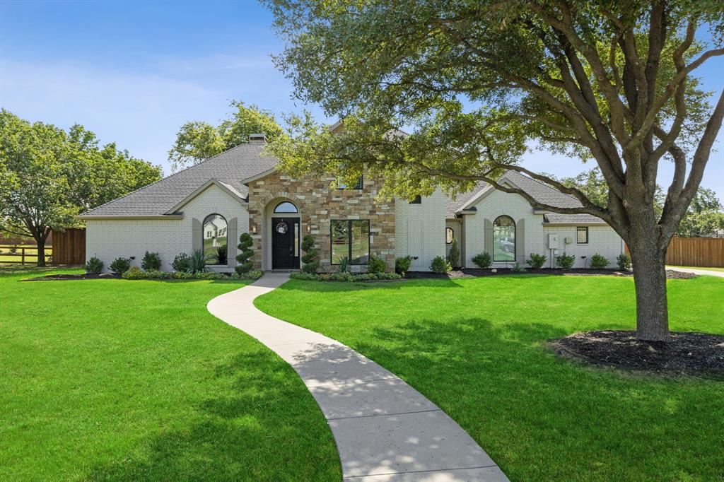 8440 Steeplechase Circle Argyle, TX 76226 - Photo 1 of 1 a view of white house with garden