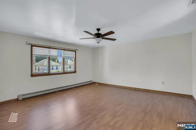 a bathroom with a sink a bathtub and a window