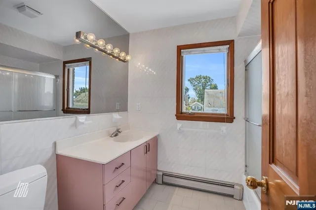 a picture of a bathroom with a picture of a park