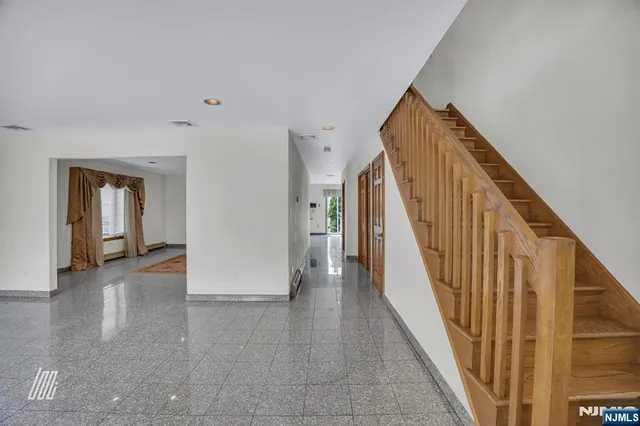 a view of a hallway with staircase