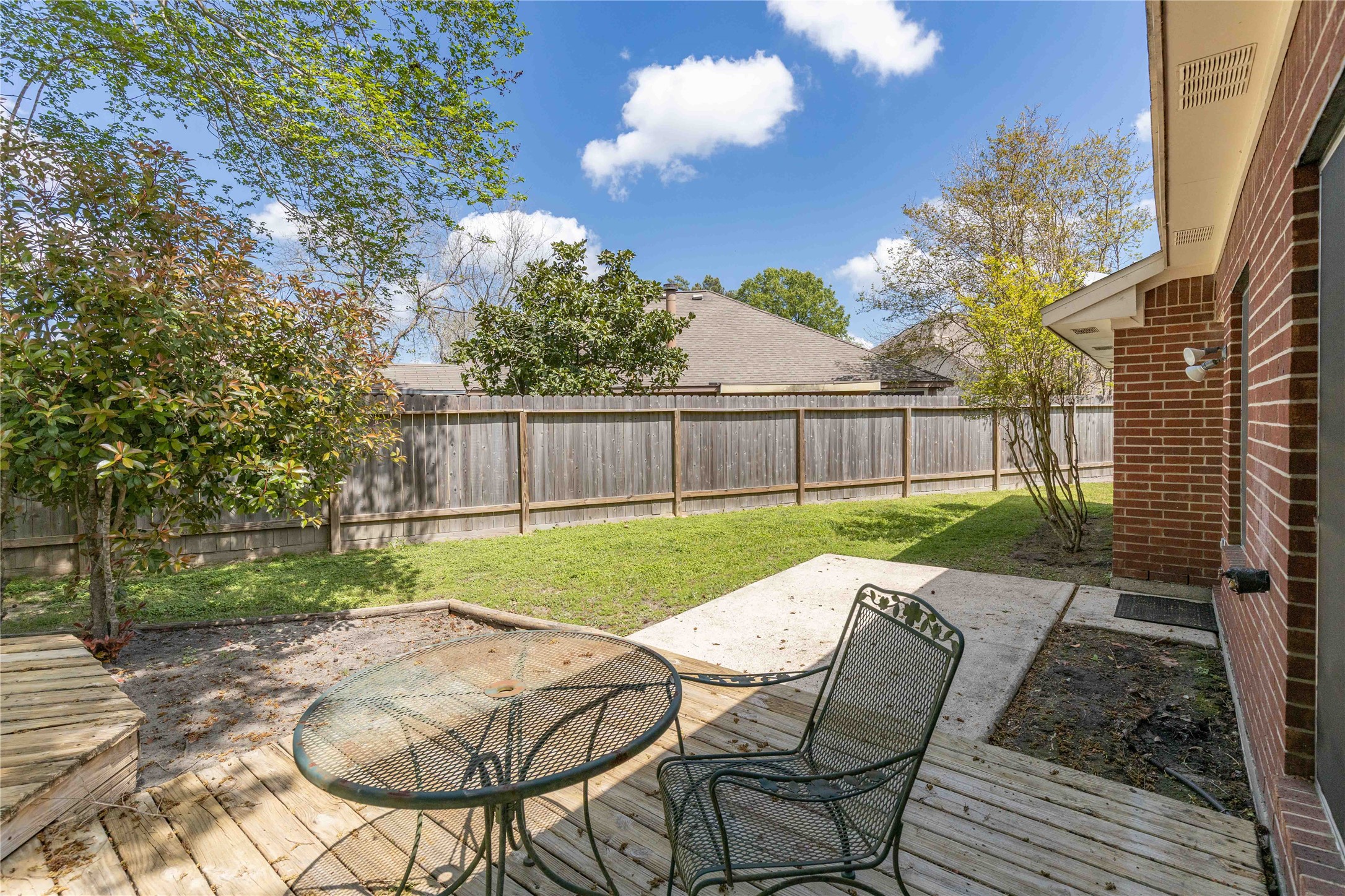 1707 Moston Drive Spring, TX 77386 - Photo 34 of 41 a view of backyard with seating and green space