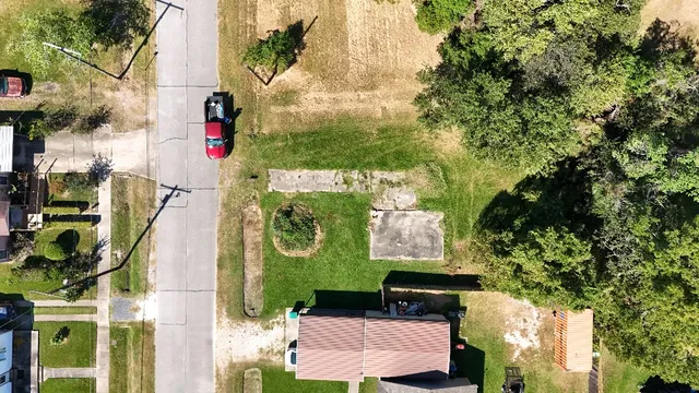 an aerial view of residential houses with outdoor space