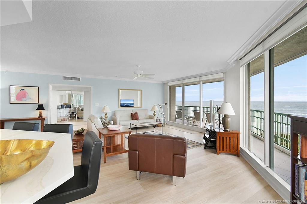 8600 South Ocean Drive, Unit 306 Jensen Beach, FL 34957 - Photo 13 of 76 a living room with fireplace furniture and a large window