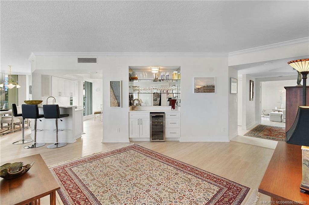 8600 South Ocean Drive, Unit 306 Jensen Beach, FL 34957 - Photo 15 of 76 a living room with furniture and a rug