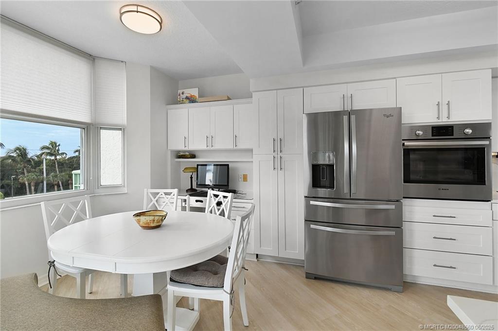 8600 South Ocean Drive, Unit 306 Jensen Beach, FL 34957 - Photo 21 of 76 a kitchen with refrigerator and stove