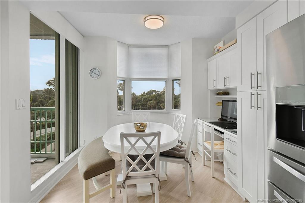 8600 South Ocean Drive, Unit 306 Jensen Beach, FL 34957 - Photo 22 of 76 a view of a dining room with furniture and a window