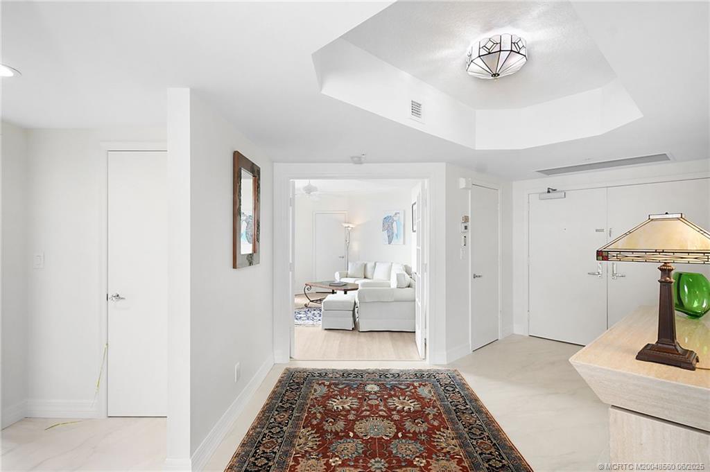 8600 South Ocean Drive, Unit 306 Jensen Beach, FL 34957 - Photo 26 of 76 a bedroom with furniture and a rug