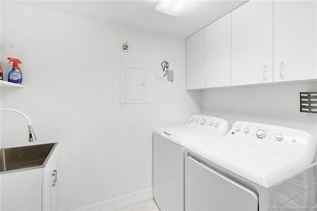 8600 South Ocean Drive, Unit 306 Jensen Beach, FL 34957 - Photo 54 of 76 a utility room with dryer and washer