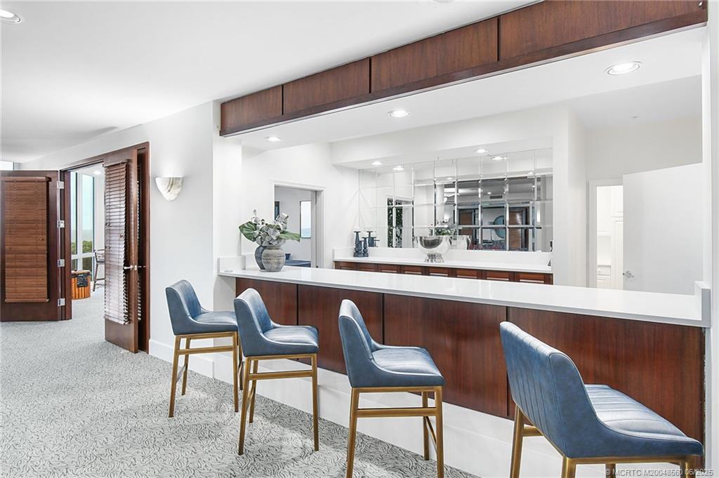 8600 South Ocean Drive, Unit 306 Jensen Beach, FL 34957 - Photo 59 of 76 a dining room with furniture and window