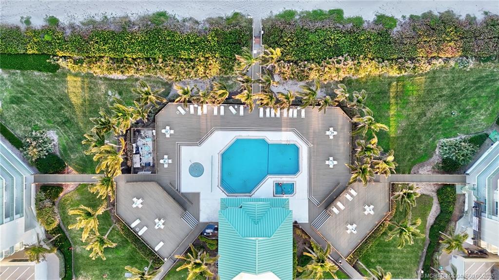 8600 South Ocean Drive, Unit 306 Jensen Beach, FL 34957 - Photo 68 of 76 an aerial view of houses with yard