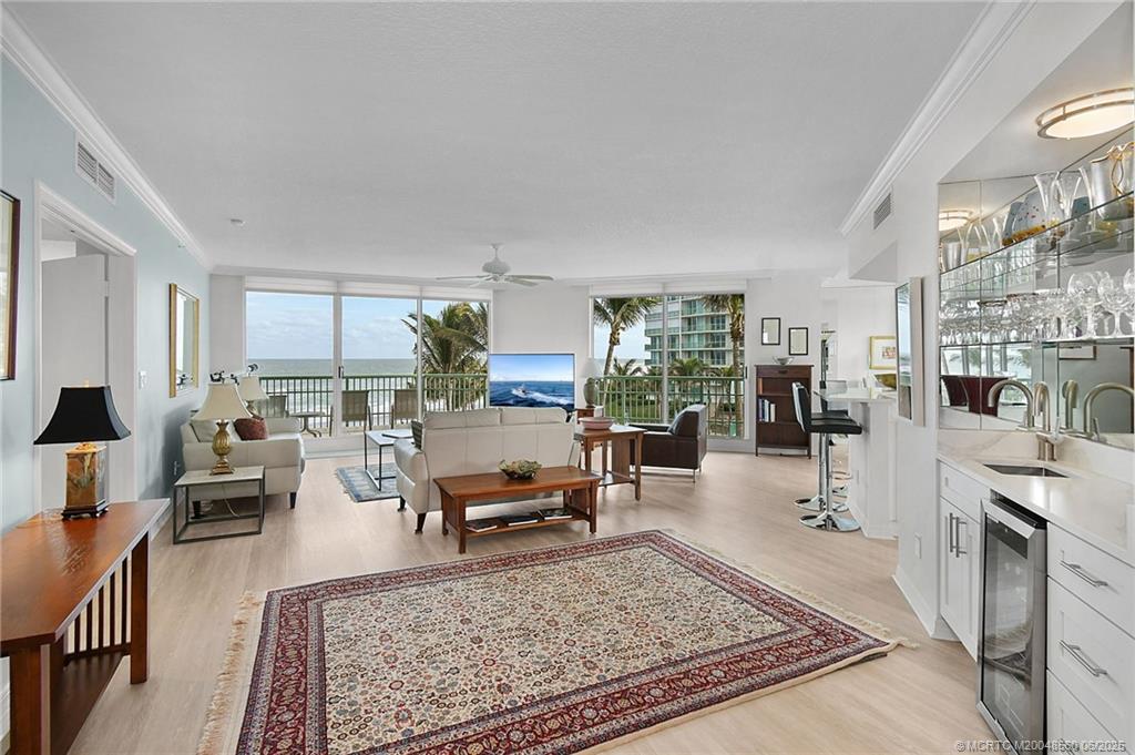 8600 South Ocean Drive, Unit 306 Jensen Beach, FL 34957 - Photo 7 of 76 a living room with furniture and a rug