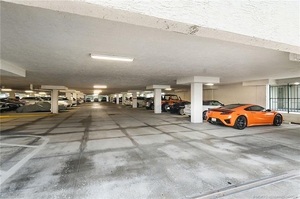 8600 South Ocean Drive, Unit 306 Jensen Beach, FL 34957 - Photo 71 of 76 a view of parking with cars parked