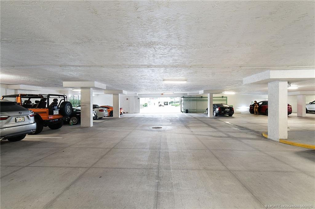 8600 South Ocean Drive, Unit 306 Jensen Beach, FL 34957 - Photo 72 of 76 a view of parking area with parked cars
