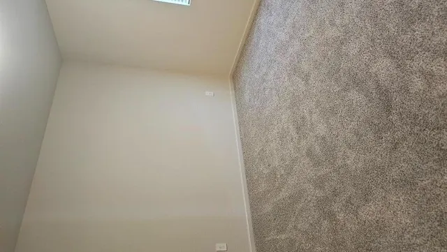a kitchen with granite countertop a stove and a wooden floors