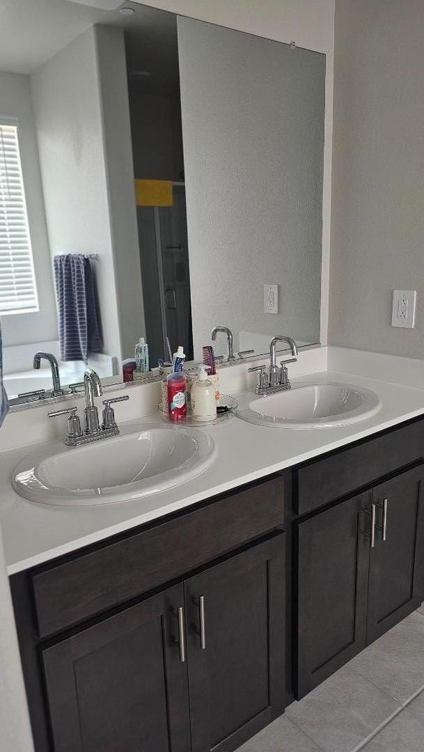 2865 Bering Street Manteca, CA 95337 - Photo 8 of 11 a bathroom with a sink and a mirror