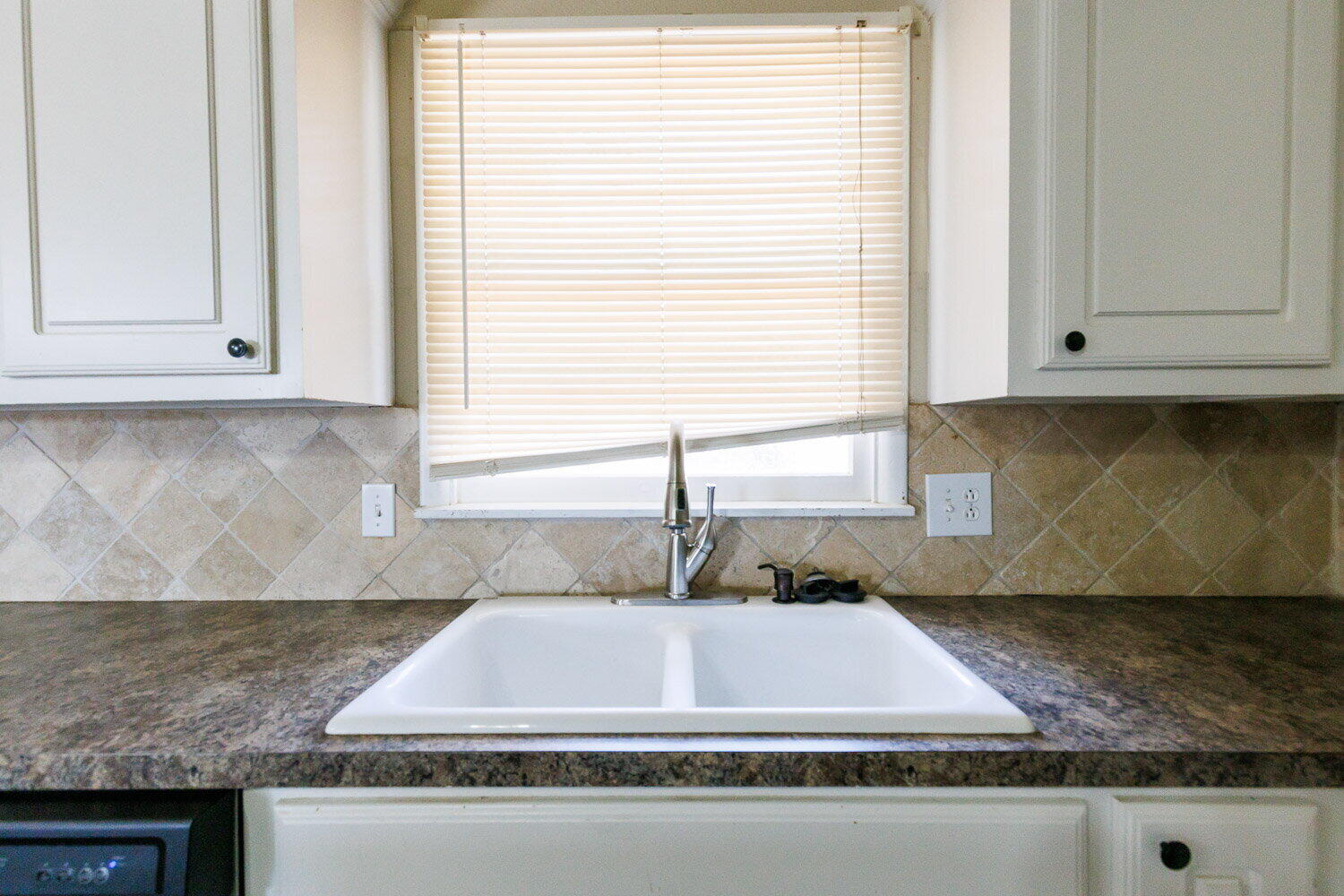 2505 52nd Street Lubbock, TX 79413 - Photo 14 of 37 a kitchen with granite countertop a sink and a stove