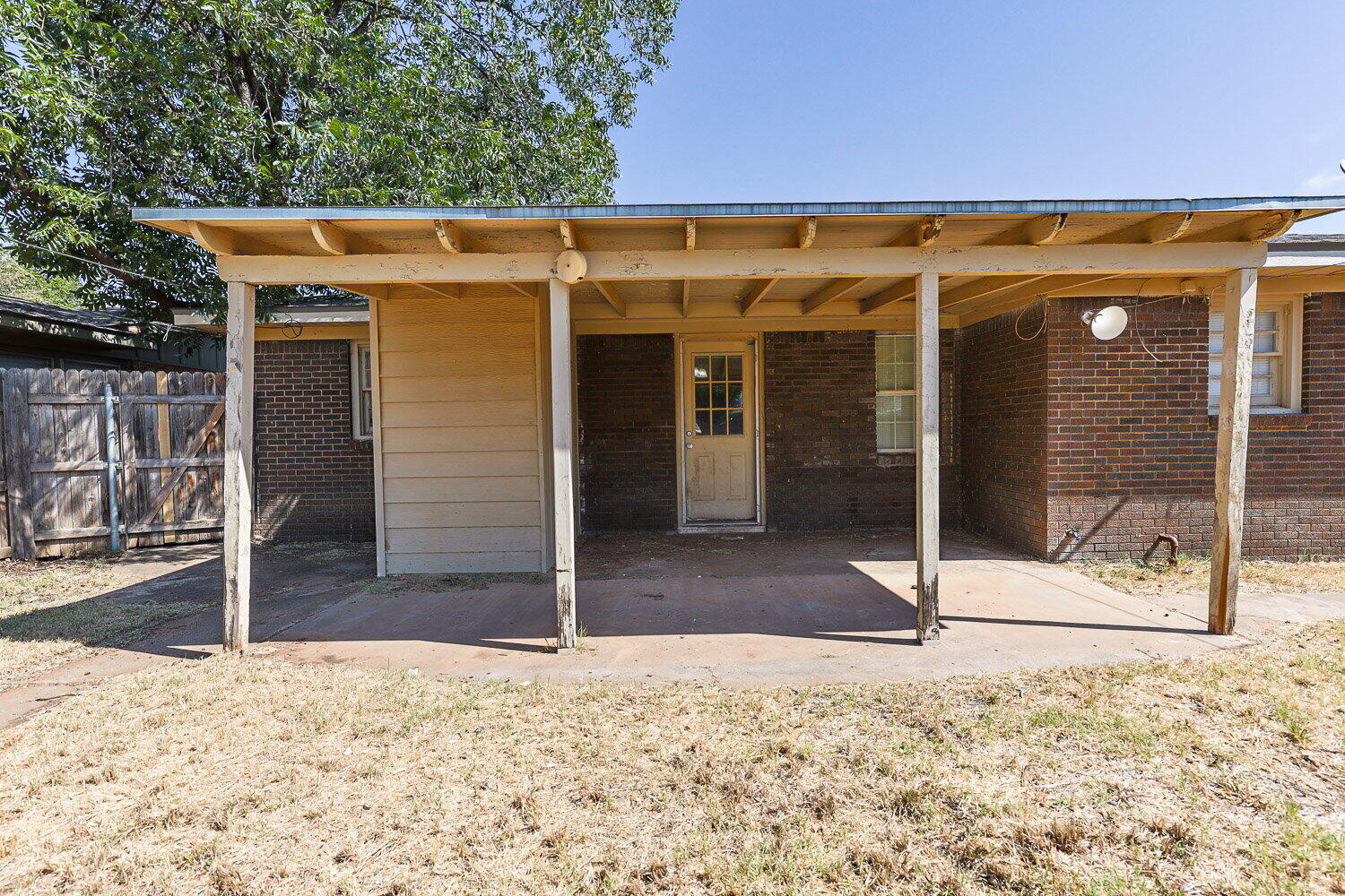 2505 52nd Street Lubbock, TX 79413 - Photo 35 of 37 a view of a house with wooden fence