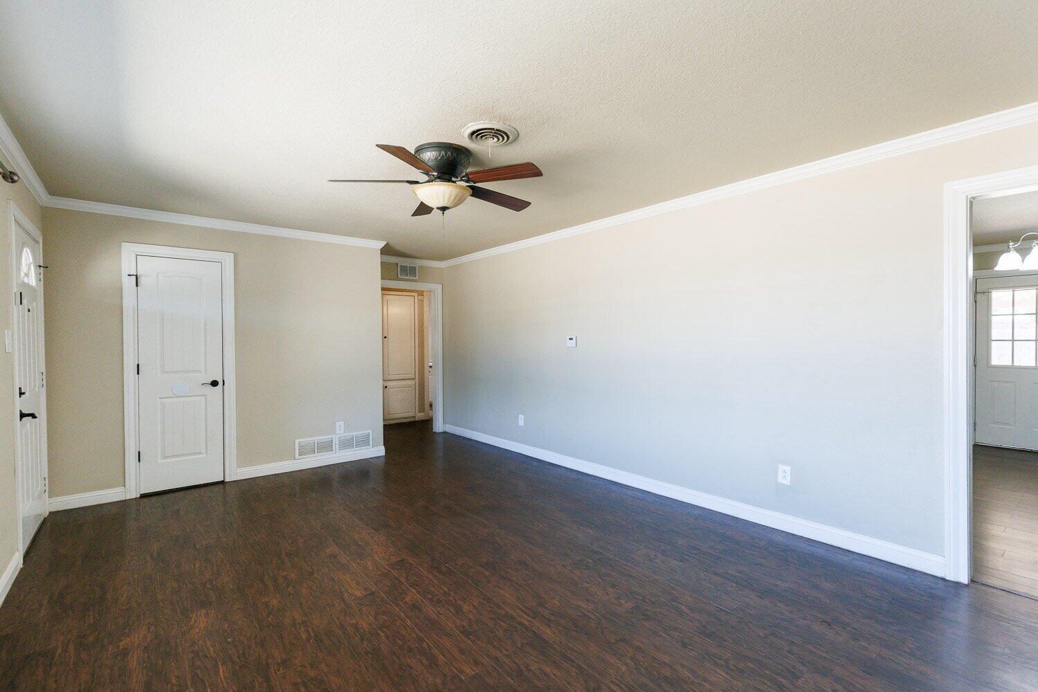 2505 52nd Street Lubbock, TX 79413 - Photo 5 of 37 a view of a big room with wooden floor and windows