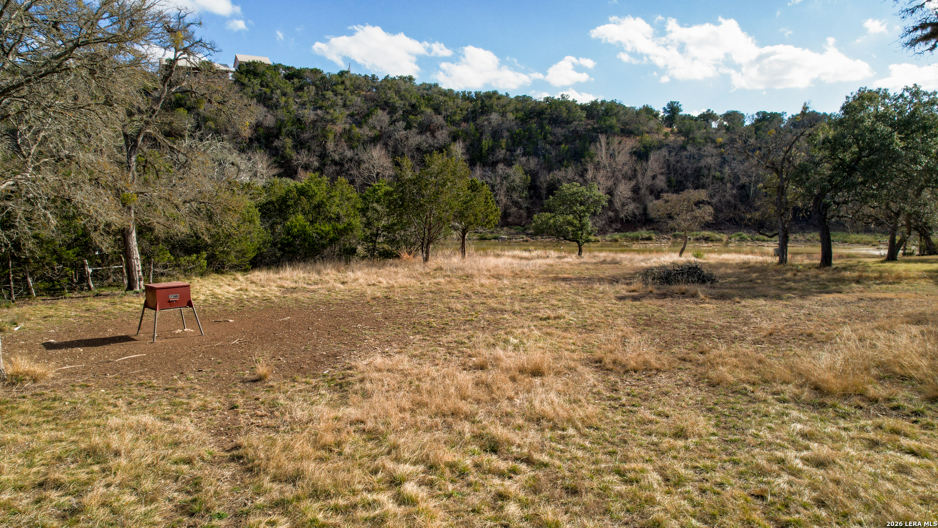 196 B Rock Bottom Road Hunt, TX 78024 - Photo 46 of 54 a backyard of a house with lots of green space