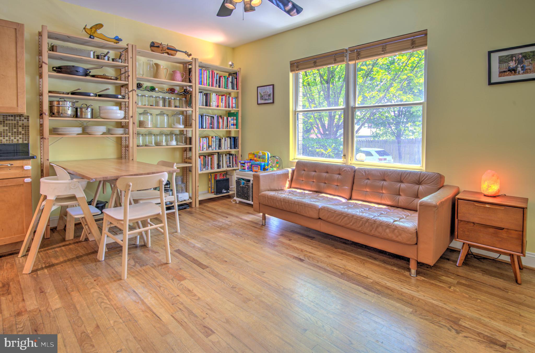 1302 Childress Street Northeast, Unit 4 Washington, DC 20002 - Photo 3 of 17 a living room with furniture and a wooden floor
