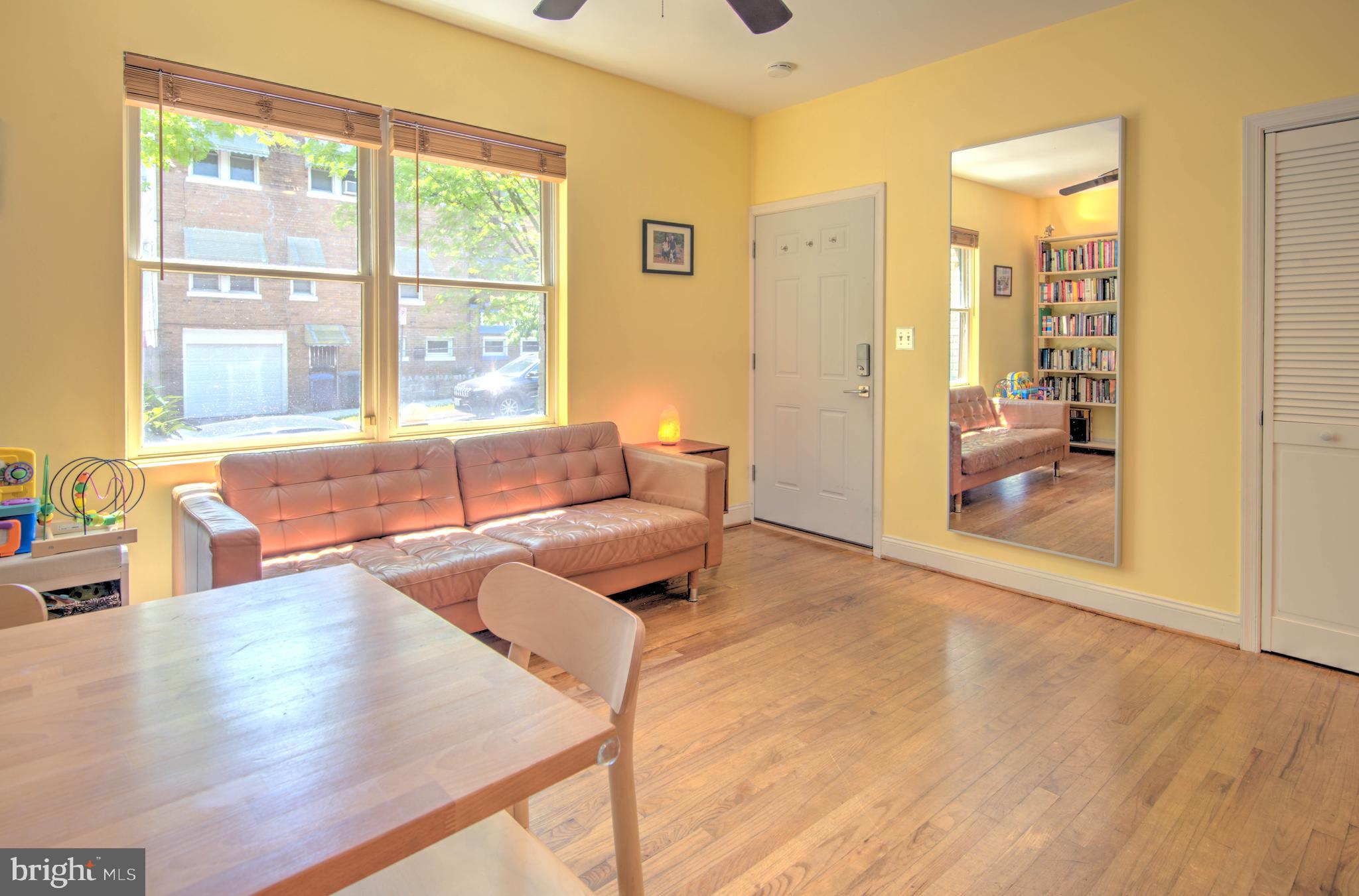 1302 Childress Street Northeast, Unit 4 Washington, DC 20002 - Photo 5 of 17 a living room with furniture and a large window