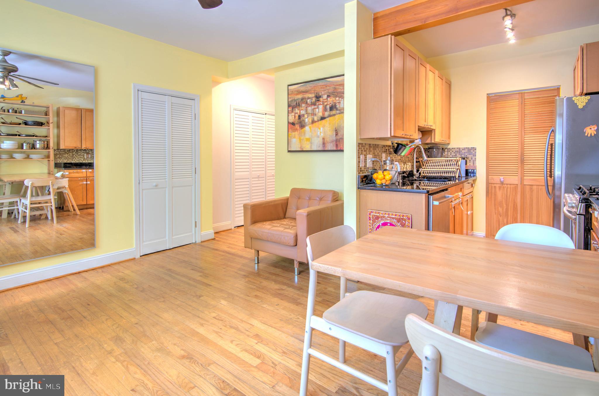 1302 Childress Street Northeast, Unit 4 Washington, DC 20002 - Photo 6 of 17 a living room with stainless steel appliances furniture stove and a kitchen view