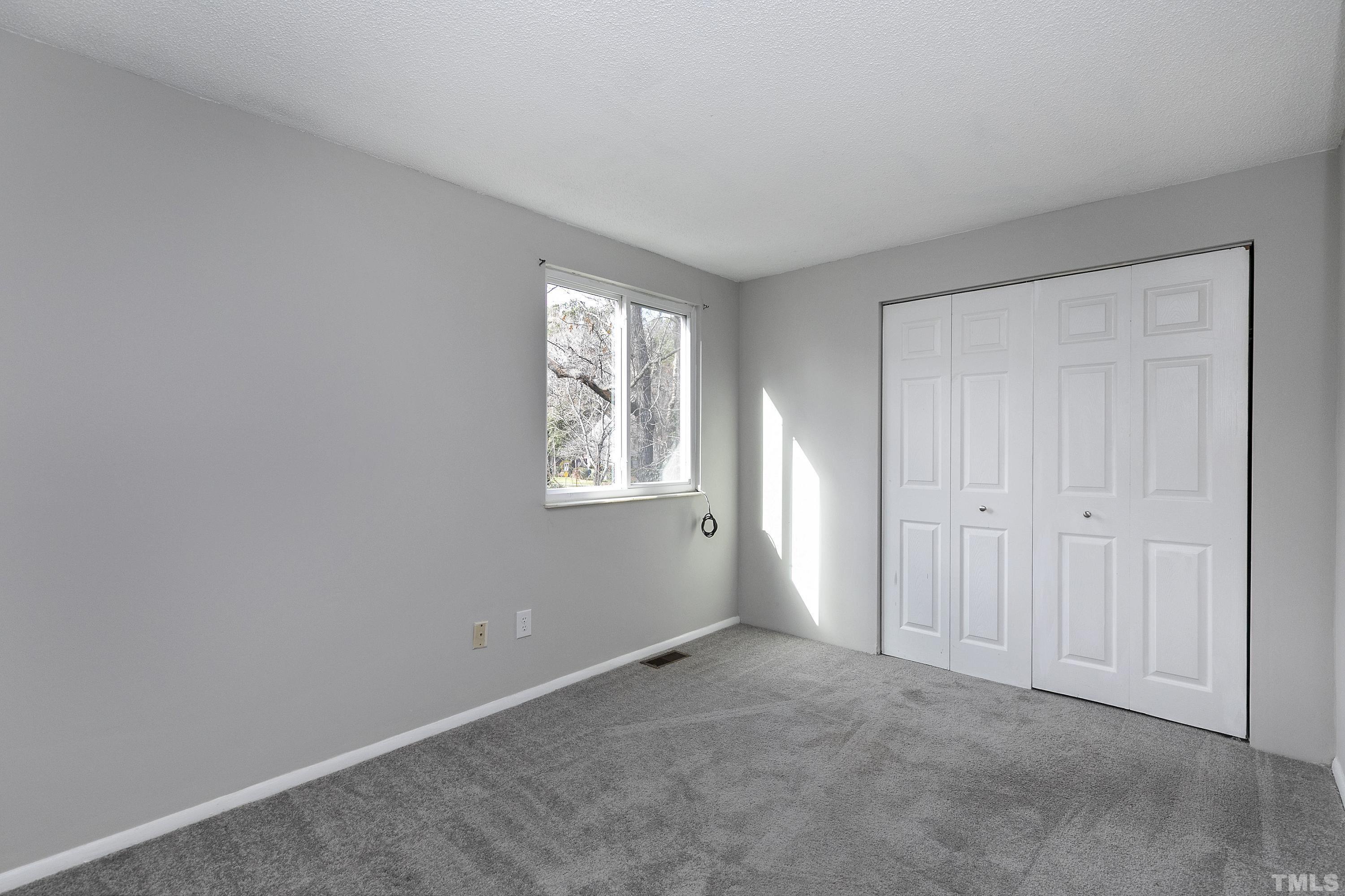 7735 Kelley Court Raleigh, NC 27615 - Photo 17 of 26 a view of an empty room with a window