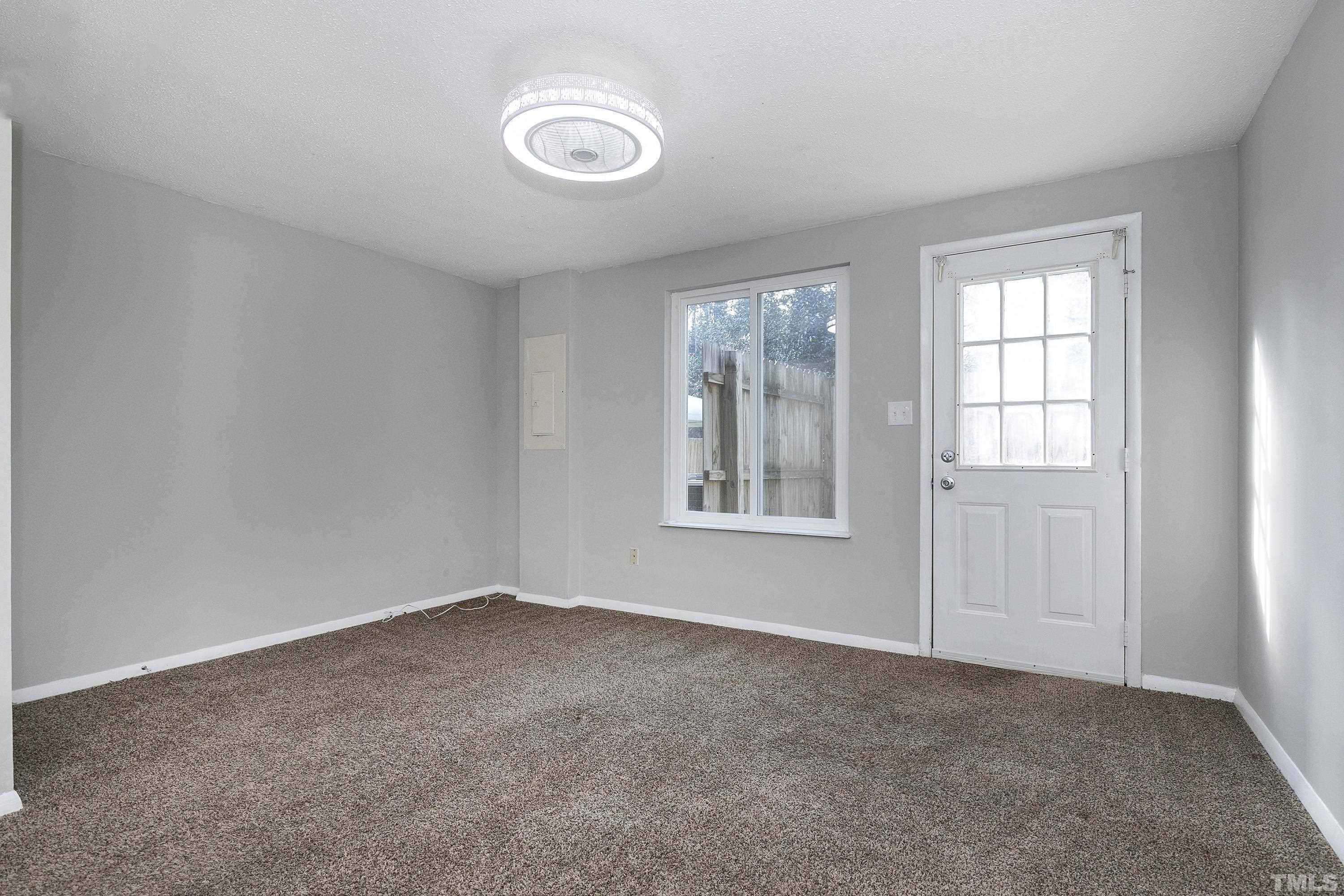 7735 Kelley Court Raleigh, NC 27615 - Photo 22 of 26 an empty room with windows