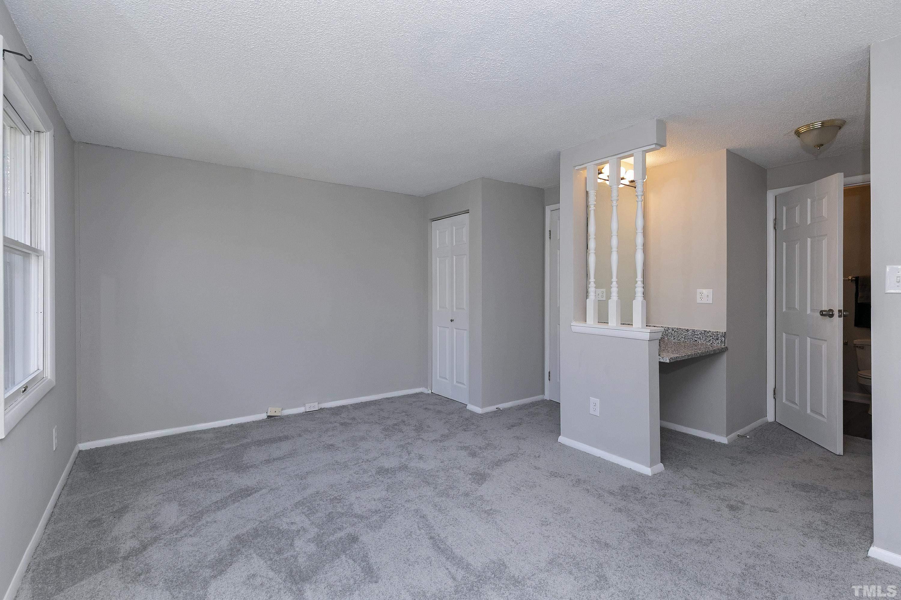 7735 Kelley Court Raleigh, NC 27615 - Photo 24 of 26 an empty room with windows