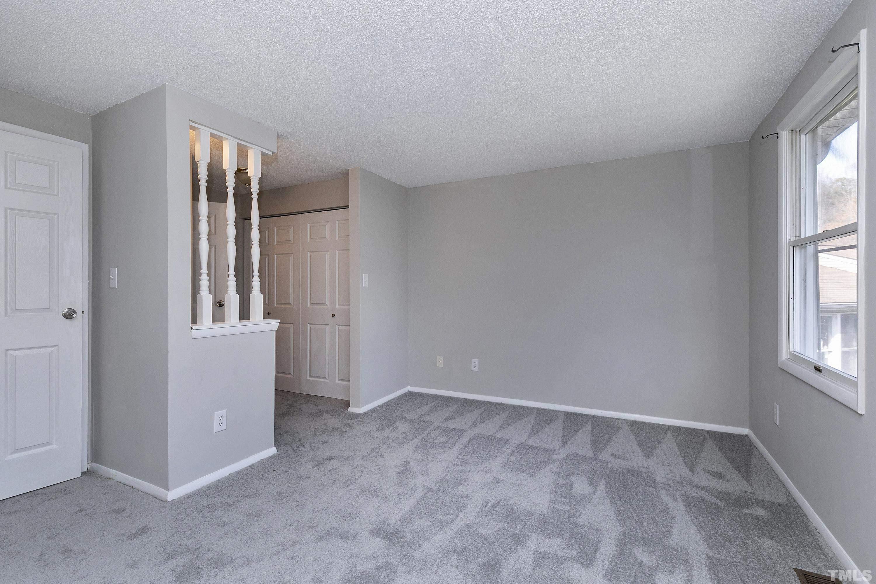 7735 Kelley Court Raleigh, NC 27615 - Photo 25 of 26 an empty room with windows