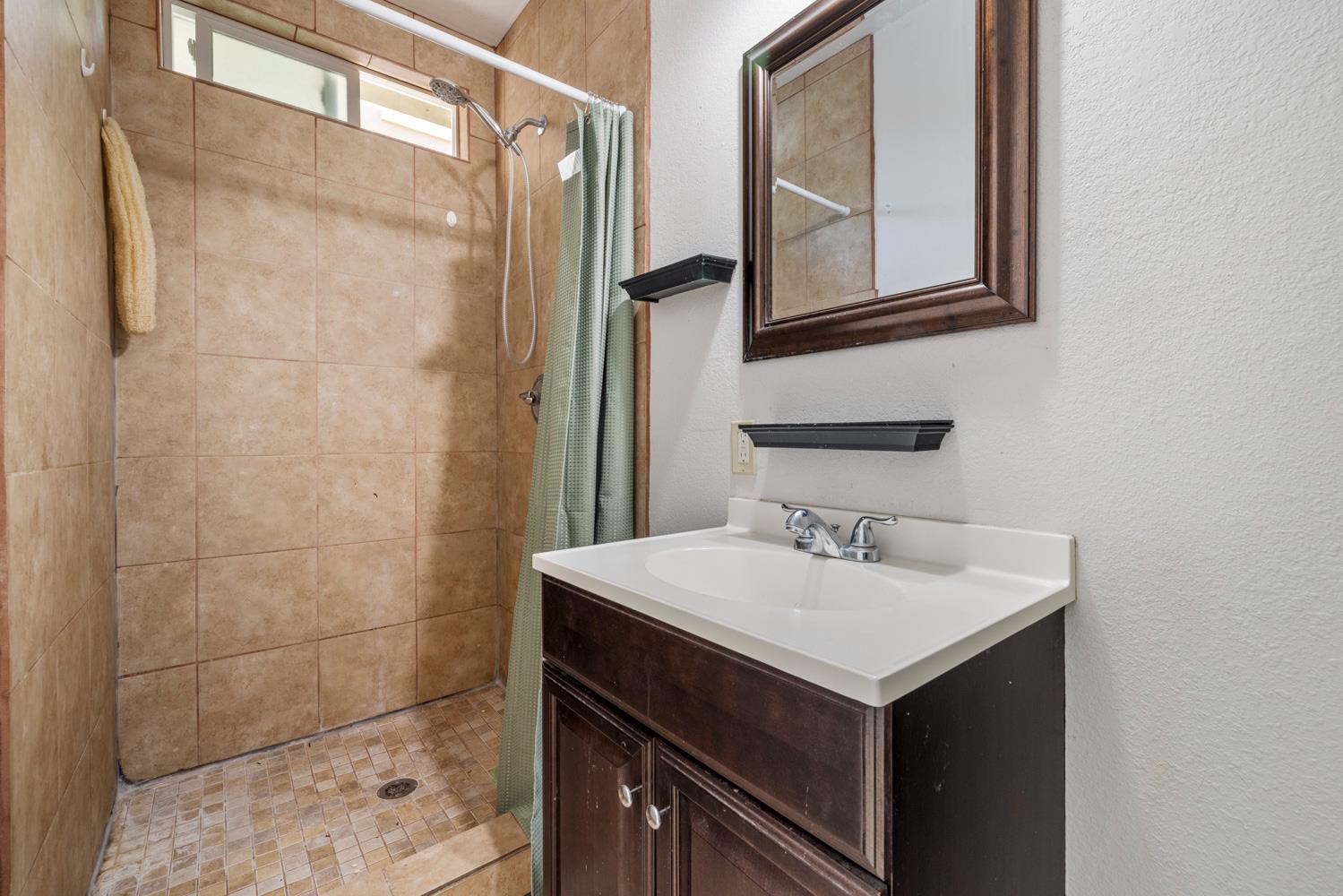 3105 Ripple Court Modesto, CA 95355 - Photo 42 of 46 a bathroom with a sink and a mirror