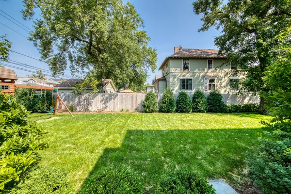 a view of a house with a yard and plants