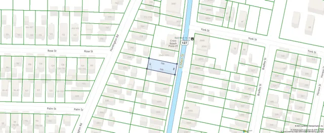 a view of a black and white wall with a window